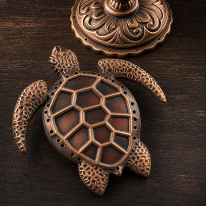 Top-down close-up of the mother sea turtle and ornamental bronze resonance dome with hexagonal shell relief