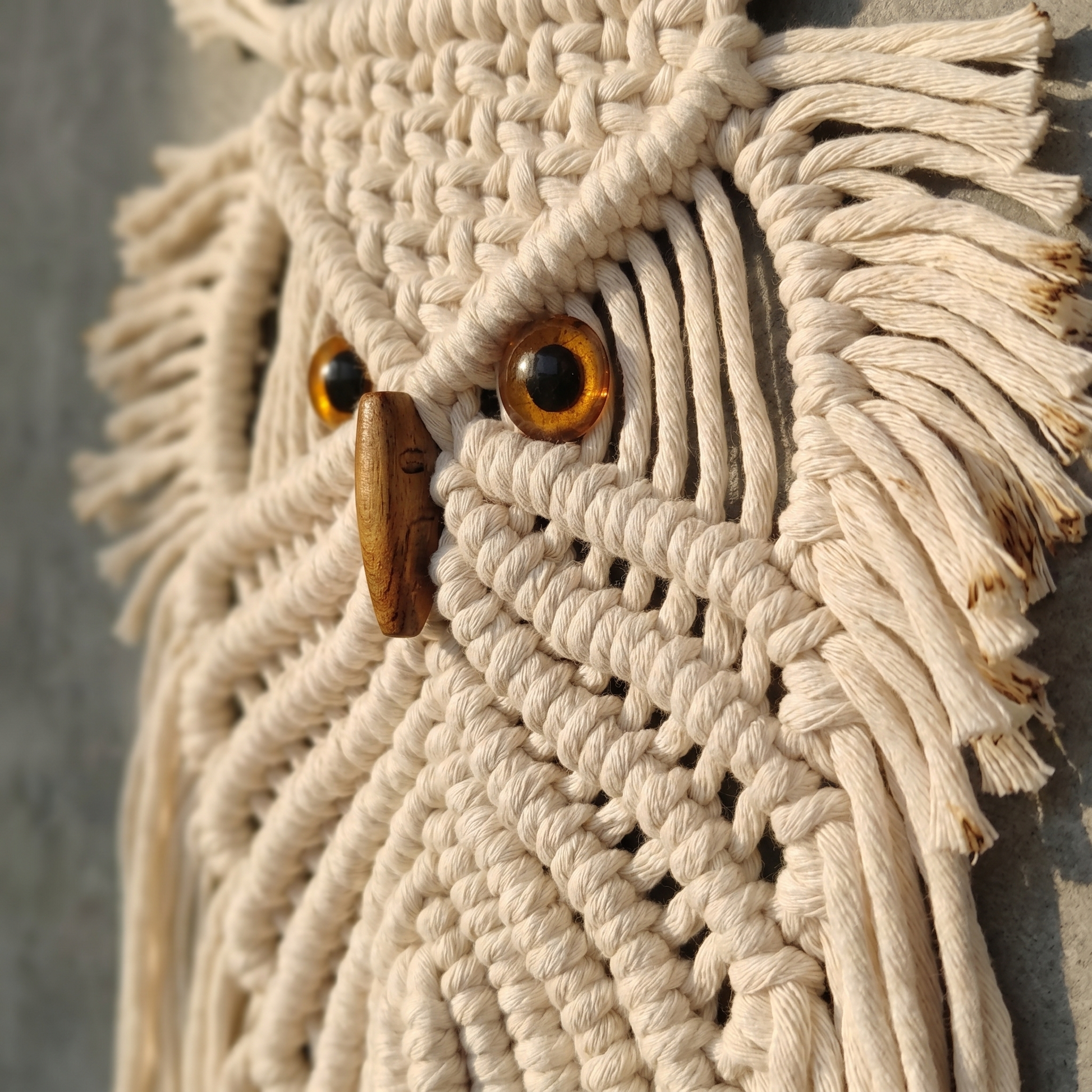 The Owl close-up - amber bead eyes and carved wooden beak