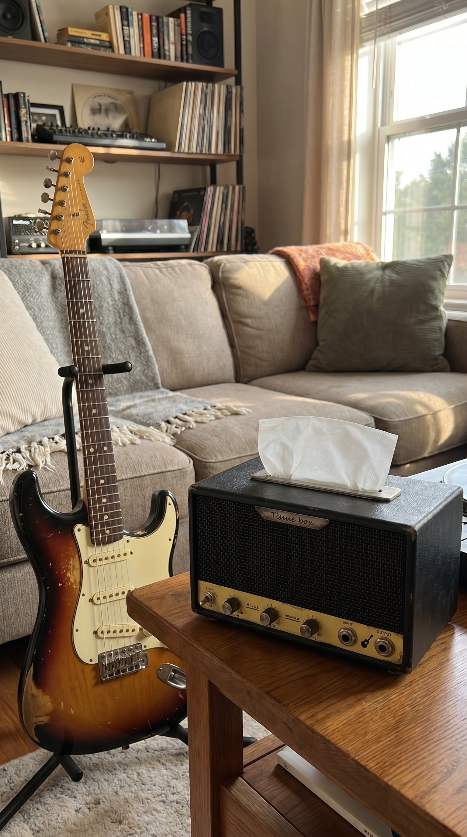 Guitar-amp tissue box in a home music room with an electric guitar