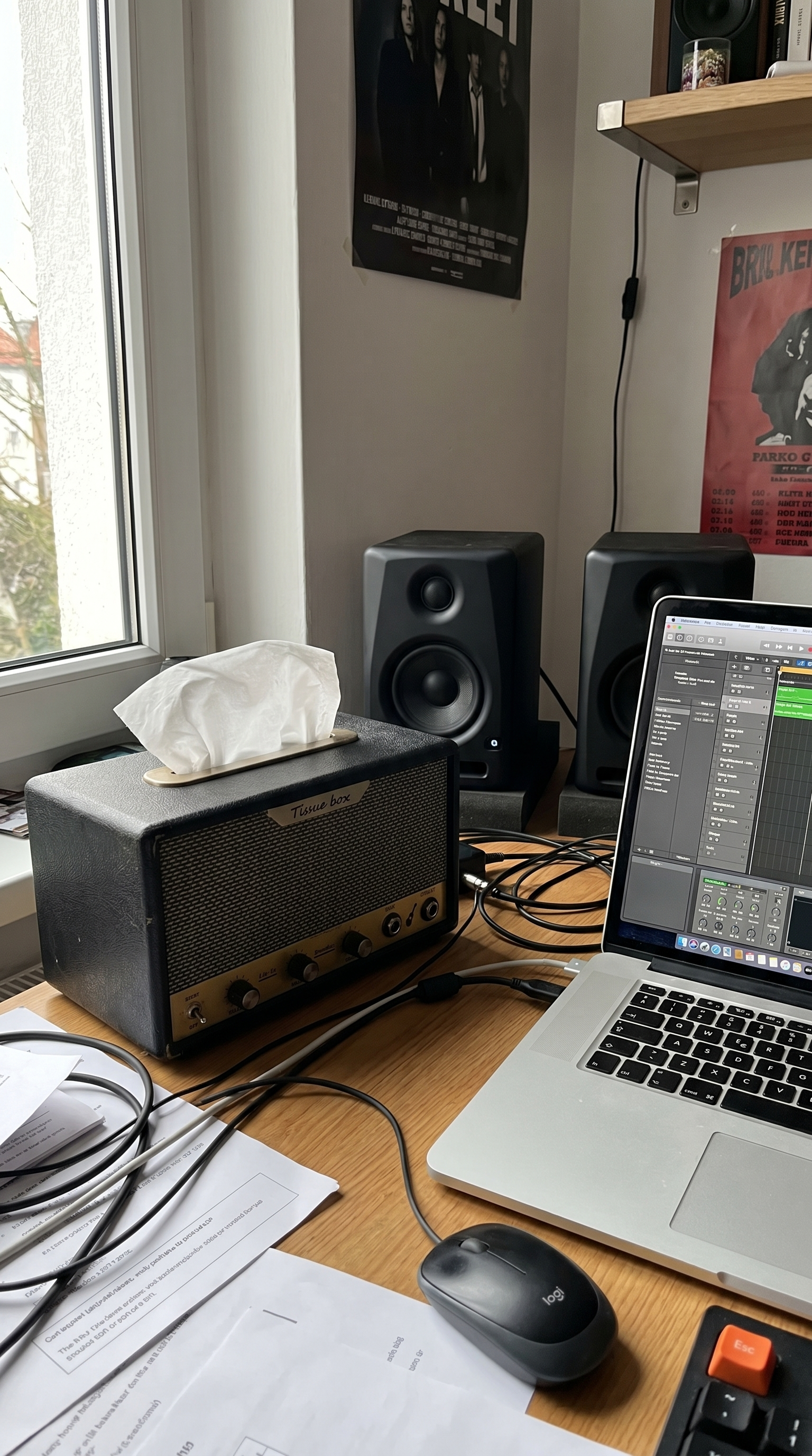 Guitar-amp tissue box on a home recording desk with studio monitors