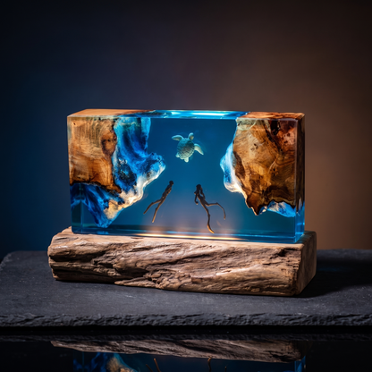 Tideglass turtle and divers ocean resin lamp on a driftwood base