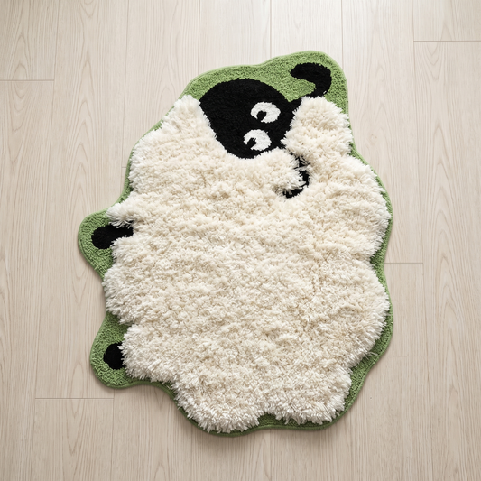 Hand-tufted sheep-shaped rug, full view on a wood floor