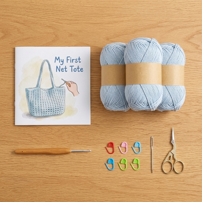 Extra Easy Net Tote kit contents: blue yarn, hook, markers, needle, scissors and pattern booklet