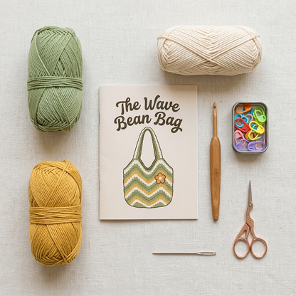 Medium Wave Bean Bag kit contents: sage and mustard yarn, hook, markers, needle, scissors and pattern booklet