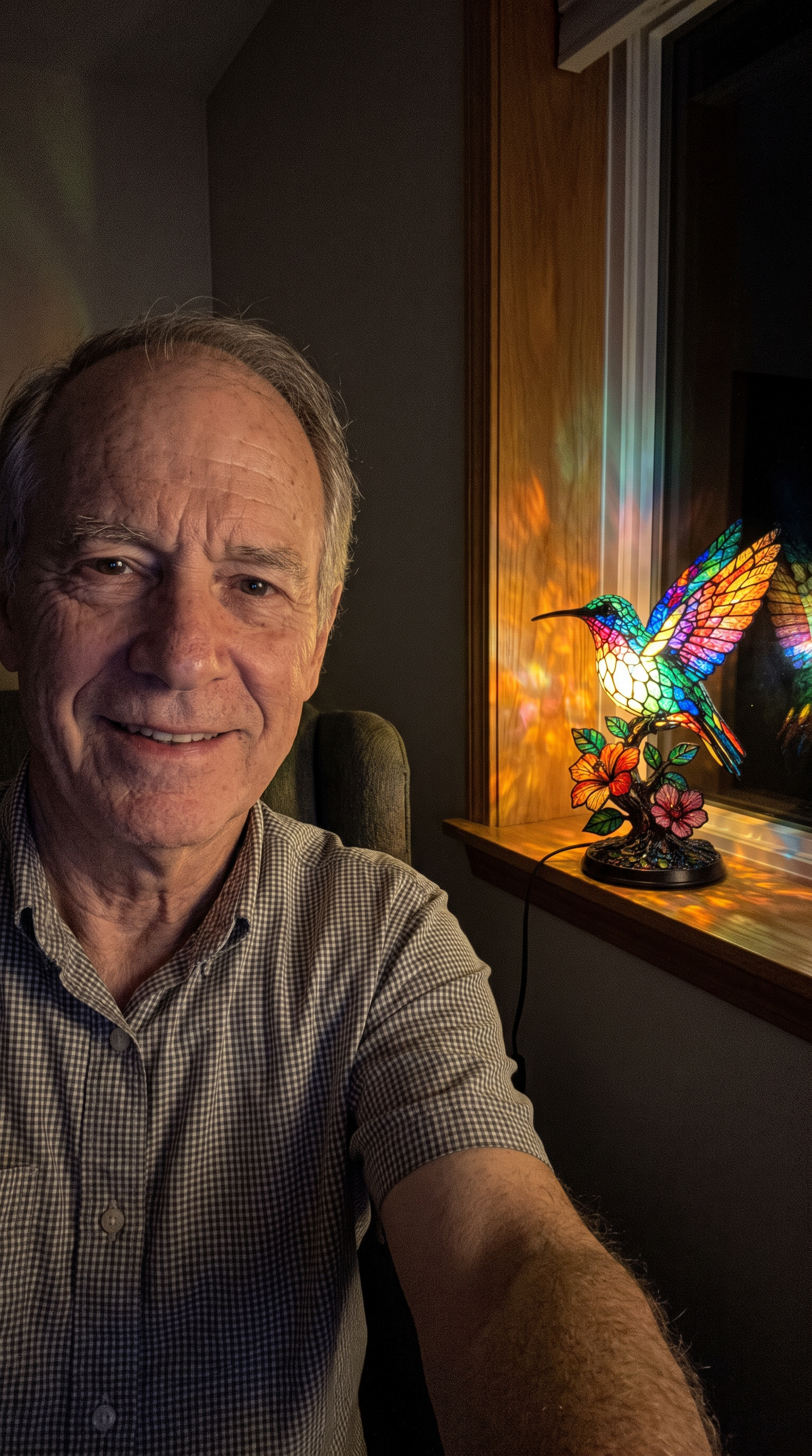 Customer selfie with the lit lamp on the windowsill behind, variant A